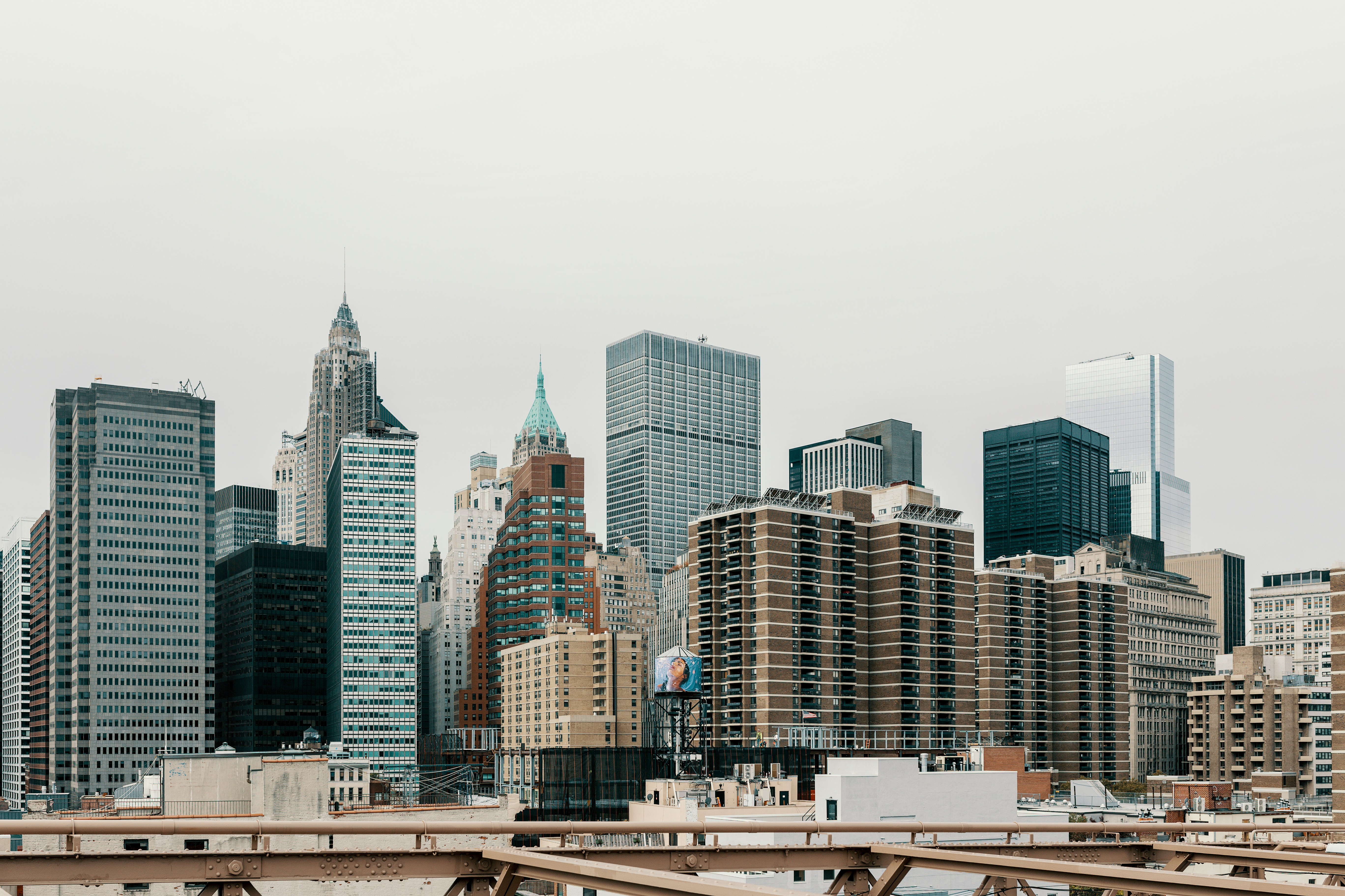 Gray silhouette of an industrial city skyline with factories and chimneys in teal and gray tones